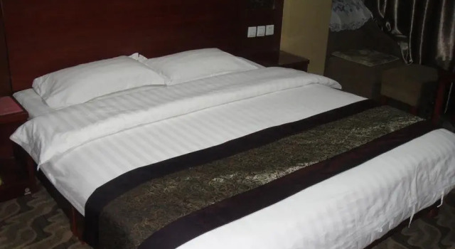 Xing Xin Hotel, Reservar Hotel Hotéis e alojamentos em Jiuquan, Hotel