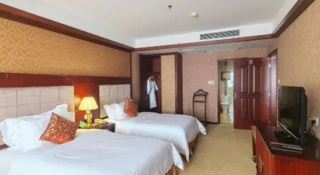 Четырёхместный люкс Executive Taishan Gaoye Hotel