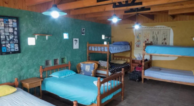 Cama en dormitorio compartido Casa Chueca - DiVino