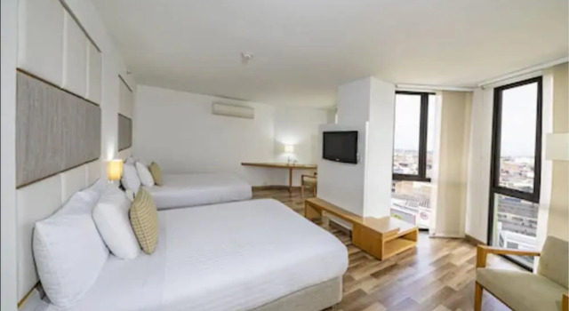Четырёхместный номер Deluxe Hotel Cosmos Cali