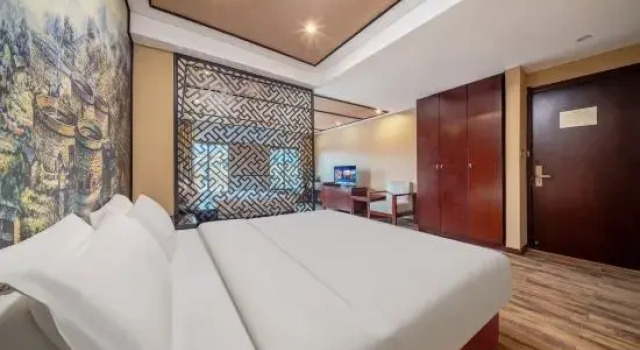 Кровать в общем номере Changxing Penglaiju Boutique Hotel