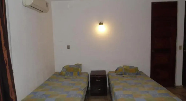 Кровать в общем номере Hostal Cumbres de El Salvador