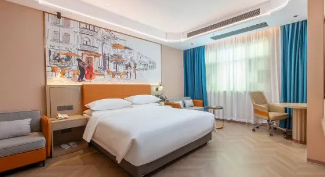 Кровать в общем номере Vienna Hotel (Jieyang Chaoshan Airport Terminal Branch)