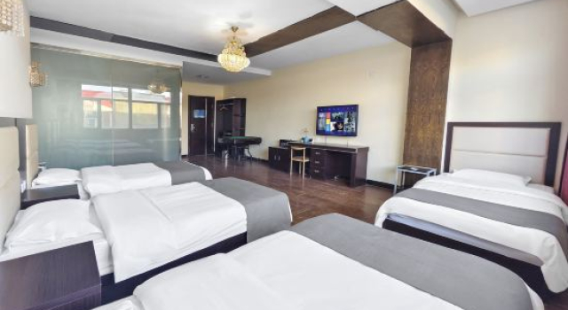 Кровать в общем номере Xiwuqi Jindi Hotel
