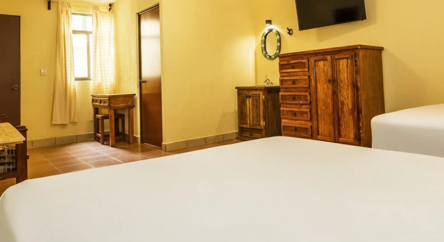 Capital O Las Calzadas Hotel & Suites