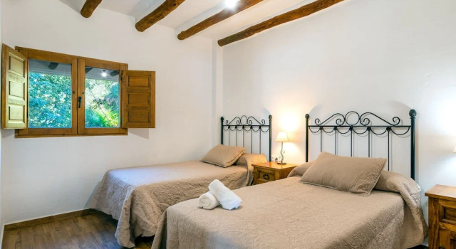 Кровать в общем номере Dreams Alpujarra