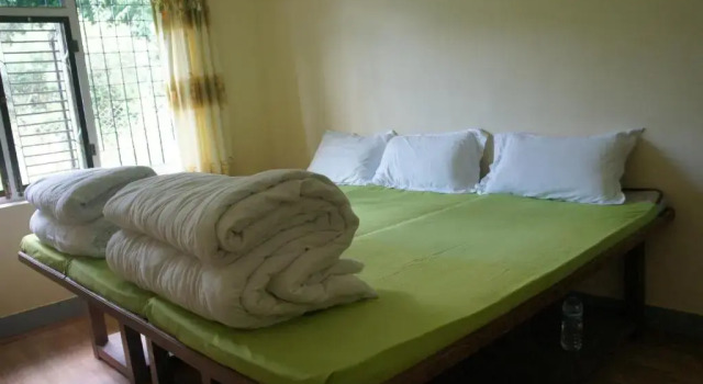 Кровать в общем номере Mount Paradise Nature Stay