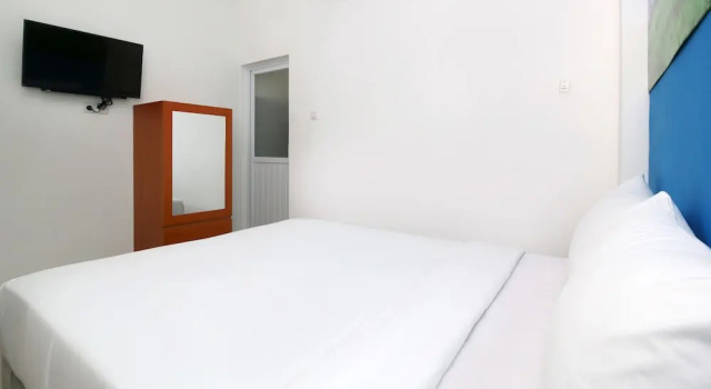 Номер Deluxe RedDoorz Plus Syariah at Polamas Andalas