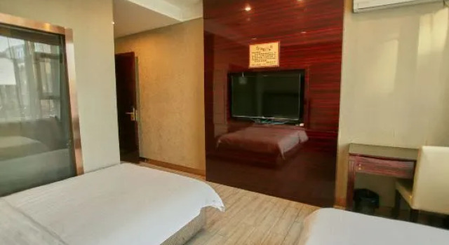 Кровать в общем номере Xiyuanquan Bathhouse Mansion