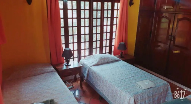 Кровать в общем номере Casa Inti Guesthouse & Lodge