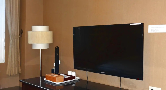 Кровать в общем номере Wuzhou Hotel