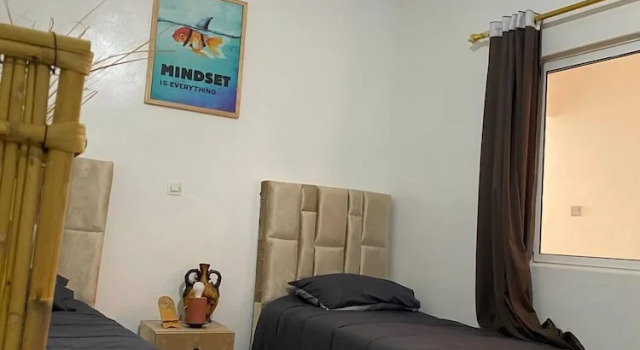 Кровать в общем номере Planet Surf Camp