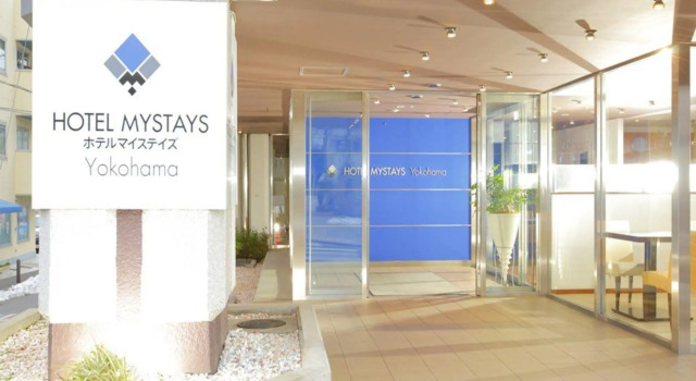 Кровать в общем номере HOTEL MYSTAYS Yokohama