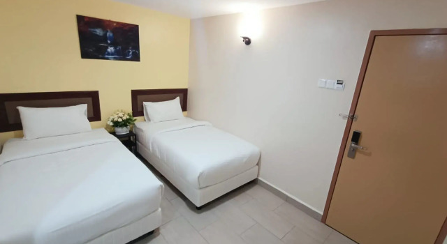 Двухместный семейный люкс Capital O 90897 Island City Hotel