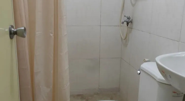 Кровать в общем номере Fiesta Ballroom Hotel