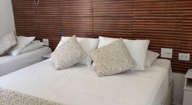 Номер Grand Pousada Pé na Areia Guarujá