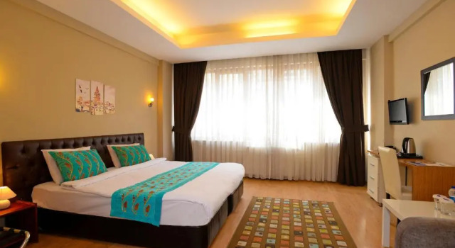 Standardowy czteroosobowy pokój Taksim Plussuite Hotel
