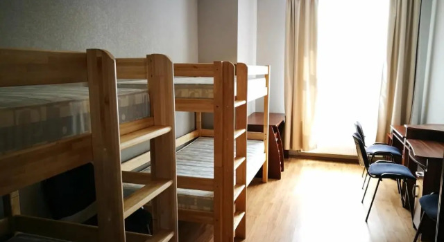 Кровать в общем номере Liela Guest Apartament