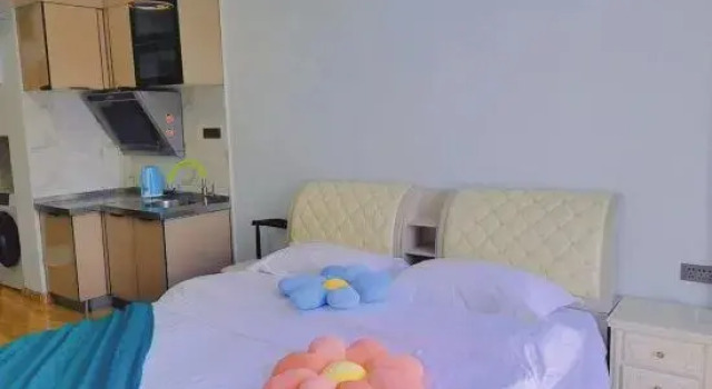 Кровать в общем номере Jianjuju B&B (Hasi Wanda Plaza)