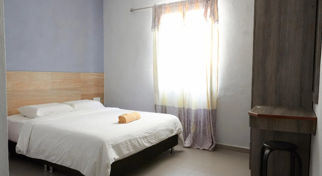 Кровать в общем номере Corrie Chalet Pantai Cenang Langkawi