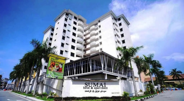 Кровать в общем номере Sumai Hotel Apartment