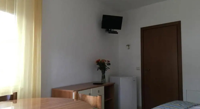Четырёхместный номер Standard с балконом и с видом на озеро Hotel Casa Piantoni