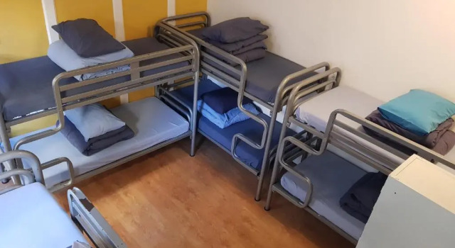Кровать в общем номере Bath Backpackers