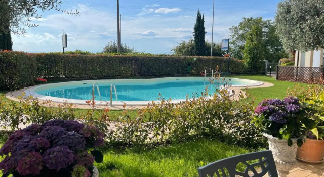 Апартаменты Appartamento con giardino privato, piscina e spiaggia a 500mt