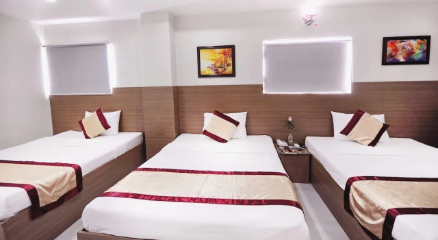 Кровать в общем номере Arise Hotel