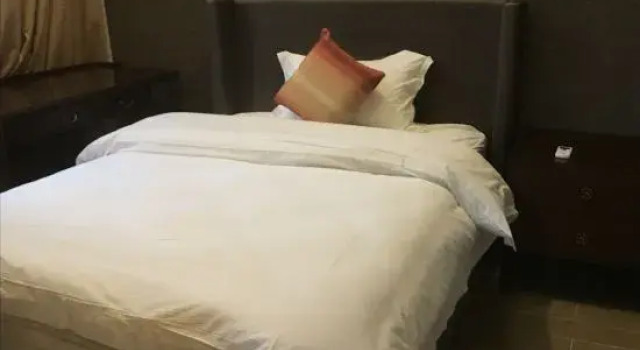 Люкс с 2 комнатами с видом на сад Yumi Holiday Apartment (Changjiang Qizi Bay)