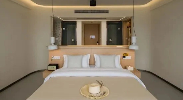 Кровать в общем номере Muxishuli Villa · Half Mountain Sea View Resort (Dali Erhai