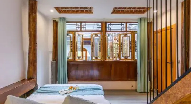 Кровать в общем номере Putuo Jianwei Hotel