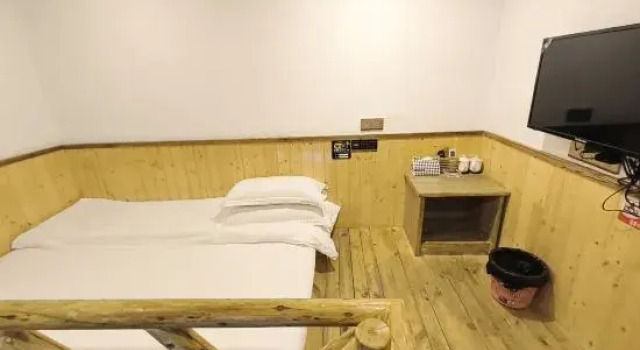 Кровать в общем номере Nanfang Jinshi Inn
