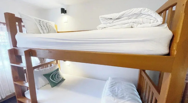 Кровать в общем номере Stay Here Hostel