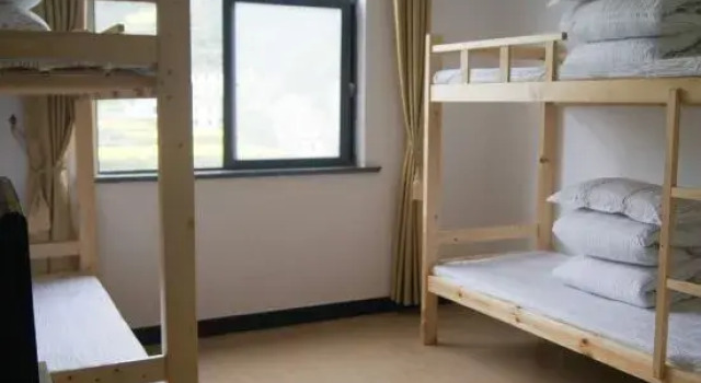 Кровать в общем номере Jixi Jiapeng Youth Hostel