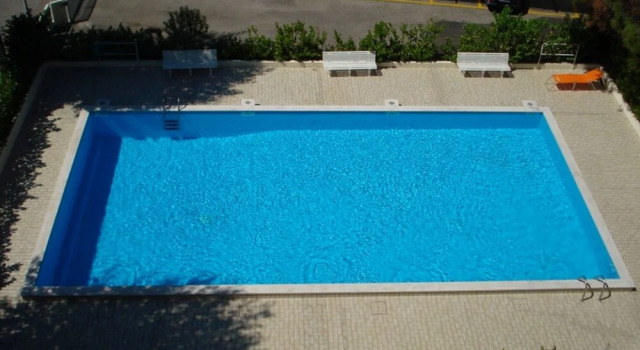 Red Flat With Shared Pool and Private Parking, Забронировать Апартаменты/квартира Каорле Линьяно-Ривьера