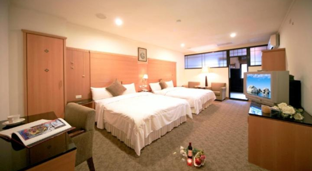 Четырёхместный номер Deluxe Ming Lu Holiday Hotel