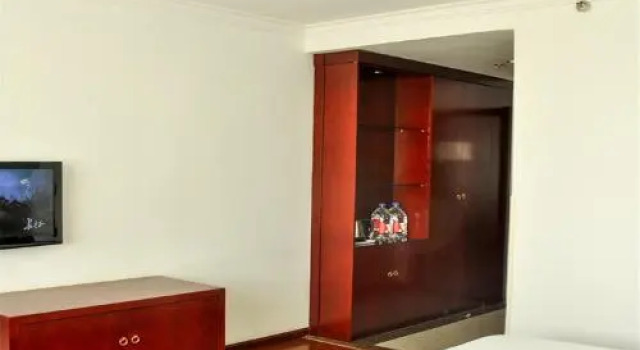 Dunhua Eastern Business Hotel, Rezervovat Hotel Dunhua Jilin