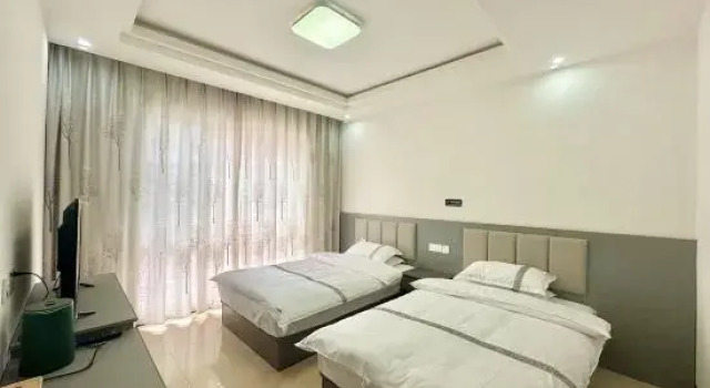 Кровать в общем номере Baili Dujuan Yongfuxuan B&B