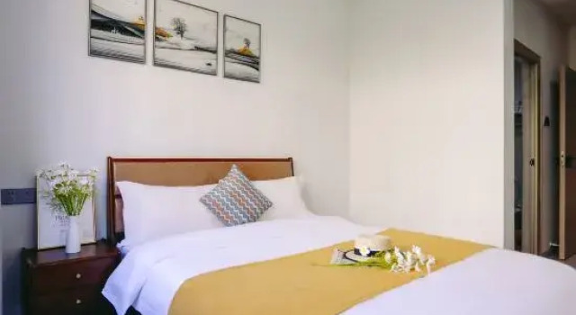 Кровать в общем номере с 6 комнатами Dingfeng Vacation Apartment (Huizhou Huilin Hot Springs)