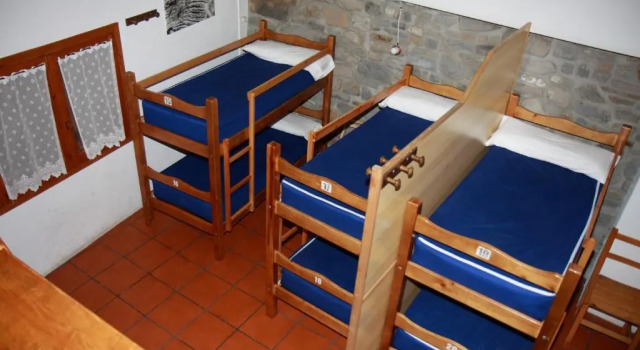 Кровать в общем номере Refugio Lucien Briet