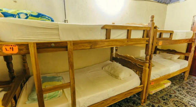 Кровать в общем номере Hostal Los Chamos