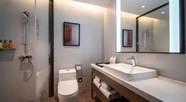 Кровать в общем номере Duoxi Road Hotel