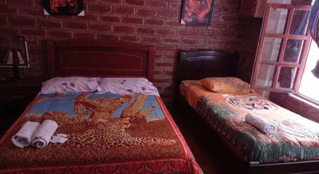 Четырёхместный номер Standard с красивым видом из окна Hostal D´Mathias
