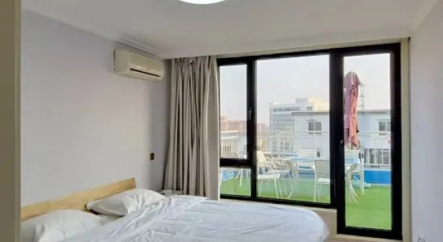 Кровать в общем номере Yuehai Huan Ting Homestay