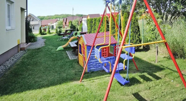Коттедж Comfort Holiday home in a holiday park Rewal at 600m from the sea