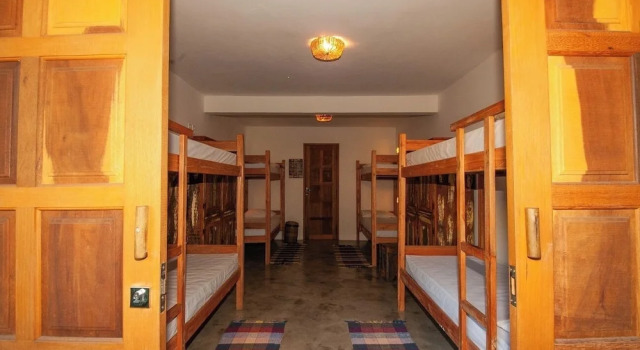 Кровать в общем номере Casa de Paixão Caraíva