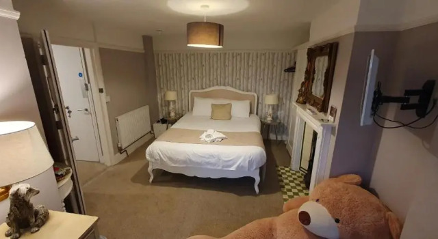 Трёхместный семейный люкс Deluxe Guestling Hall Hotel