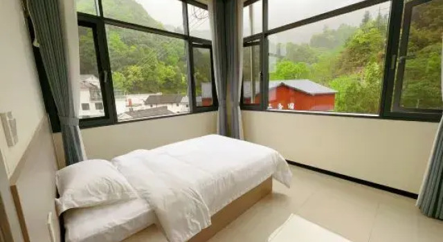 Трёхместный люкс Shitai Guniujiang Wangli B&B