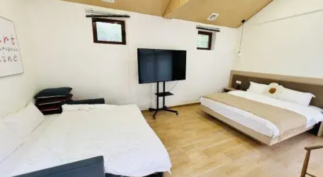Кровать в общем номере Badaling Chadao Ancient City Mansu Homestay